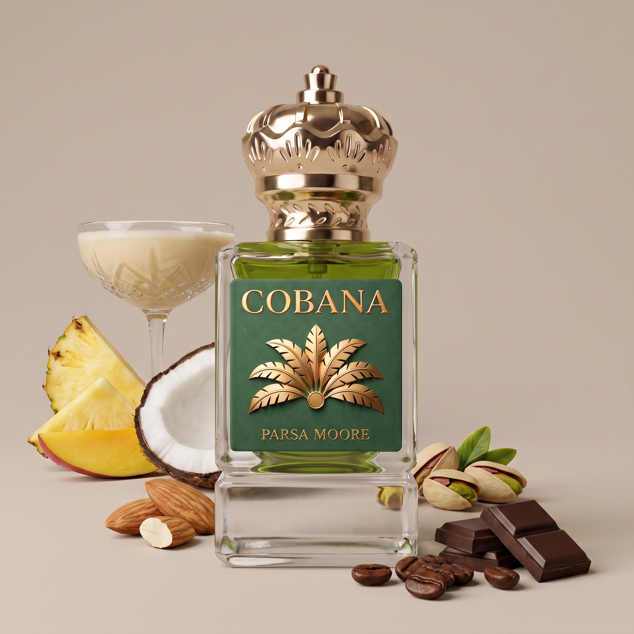 A perfume bottle labeled 'COBANA' by Parsa Moore, filled with green liquid and topped with a gold crown-shaped cap, styled on a beige background with pineapple, coconut, almonds, pistachios, chocolate pieces, and a coupe glass of cream.