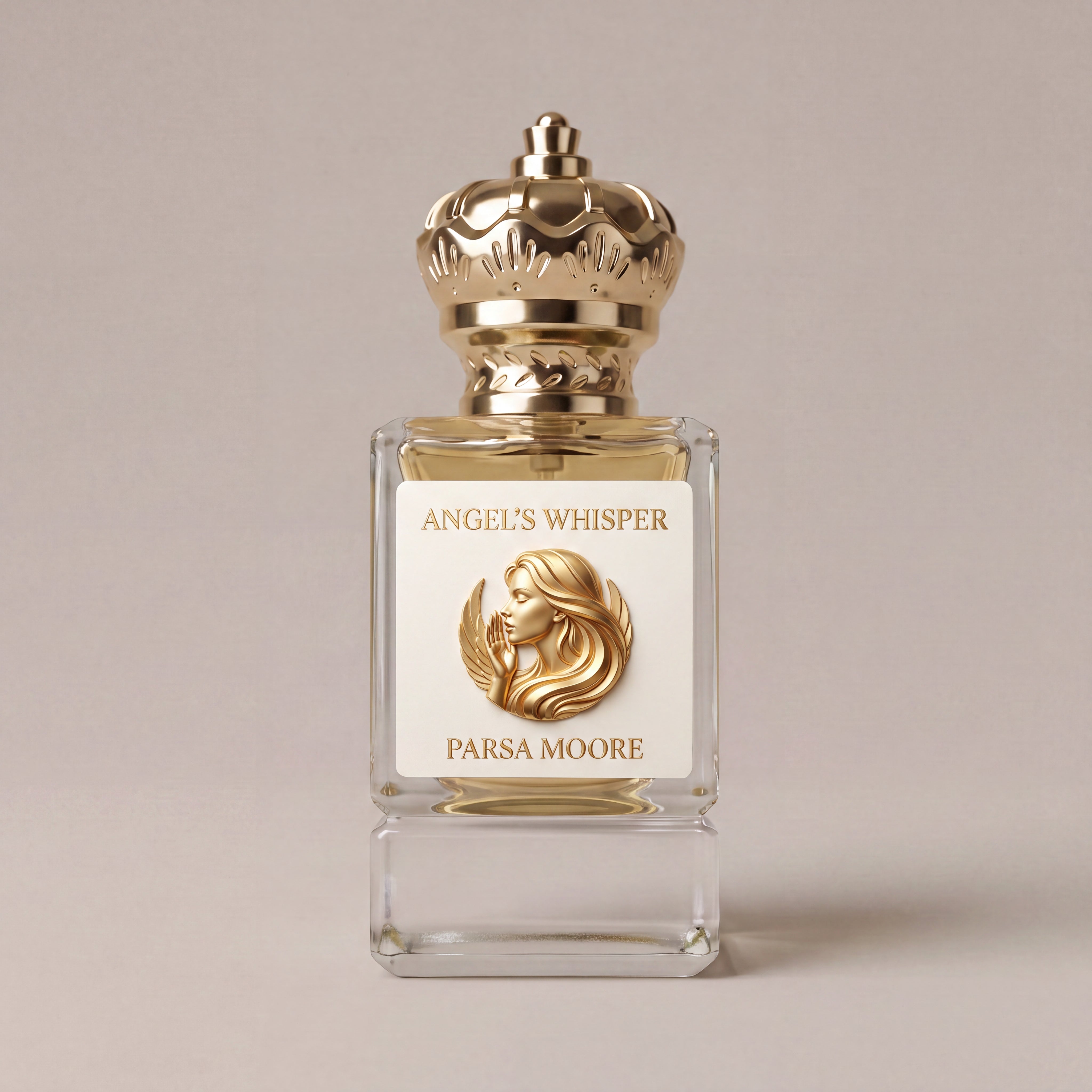A clear glass perfume bottle with a gold crown-shaped cap and a white front label reading 'ANGEL'S WHISPER' and 'PARSA MOORE,' shown on a warm beige background.