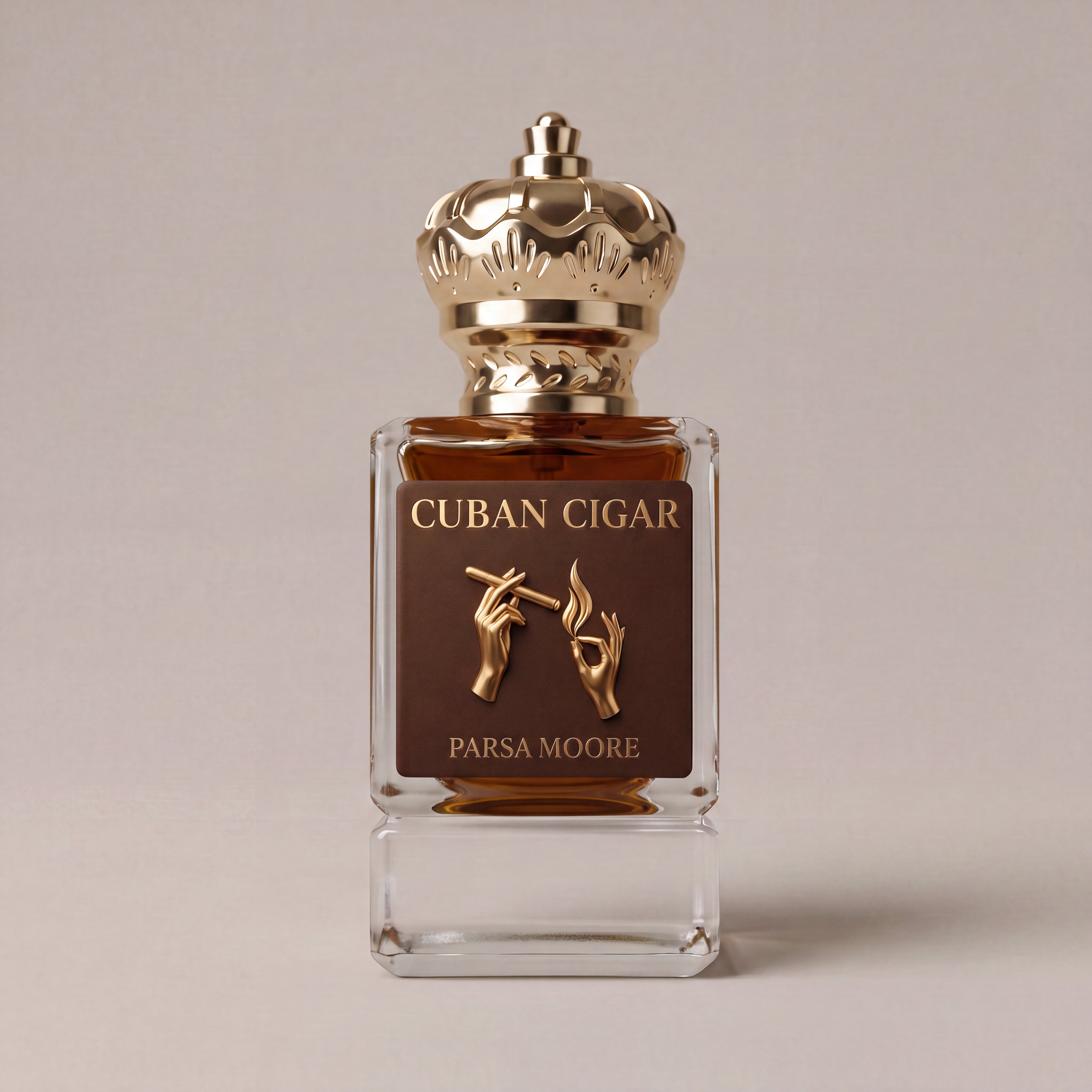 A square glass bottle of Cuban Cigar perfume by Parsa Moore, featuring a dark brown label with gold lettering and hand illustrations, topped with an ornate gold cap, set against a neutral beige background.