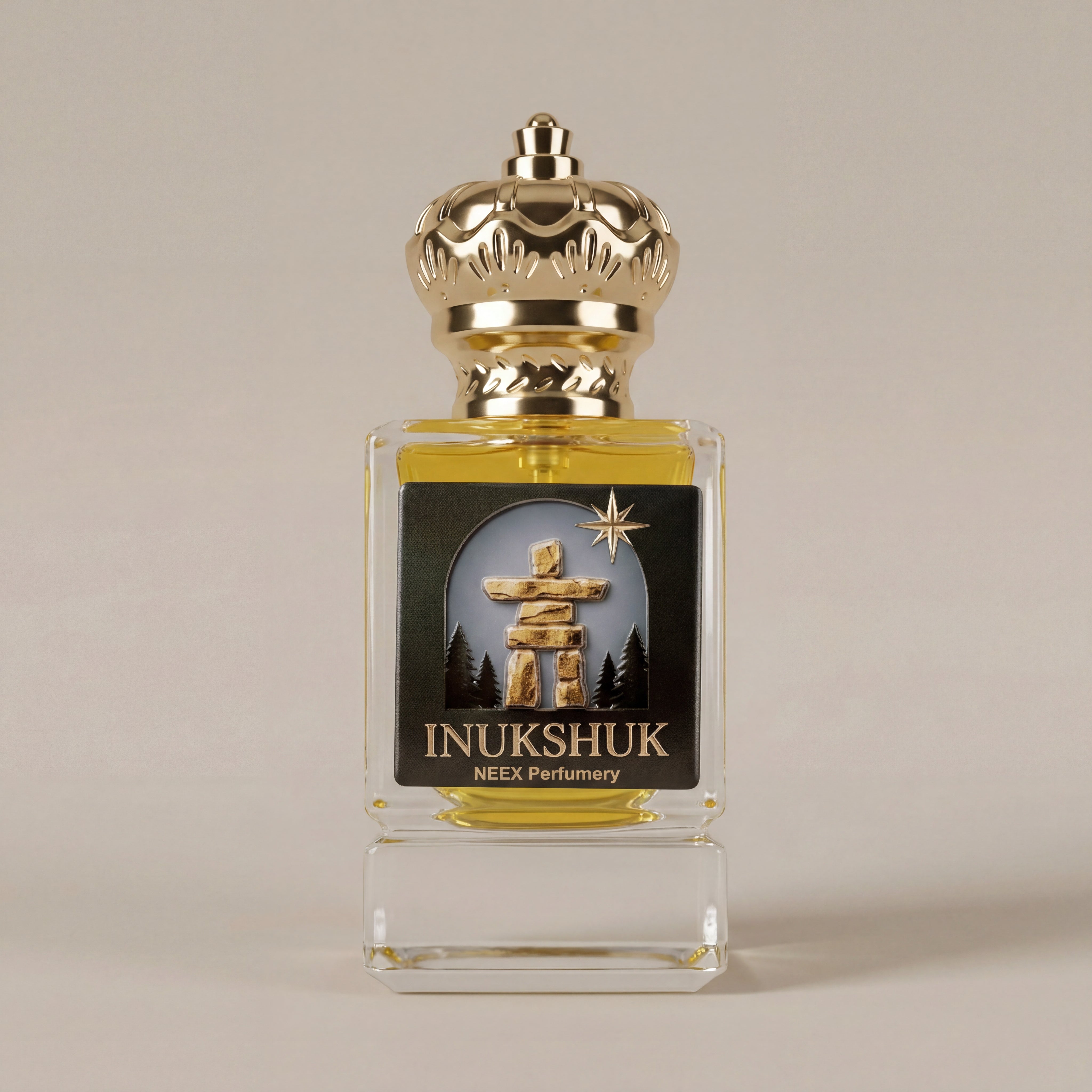 Perfume bottle labeled 'INUKSHUK' with gold cap on a beige background